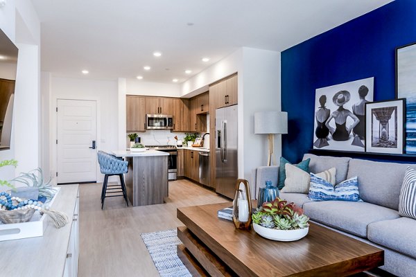 Living room with stylish furnishings and modern decor at The Lofts at Carlsbad Village Apartments