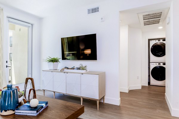 Spacious living room with modern furnishings at The Lofts at Carlsbad Village Apartments