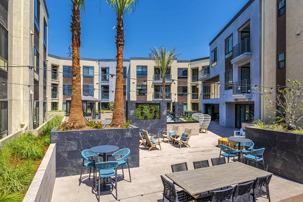 The Lofts at Carlsbad Village: Stylish patio space with modern furniture, perfect for relaxation and socializing