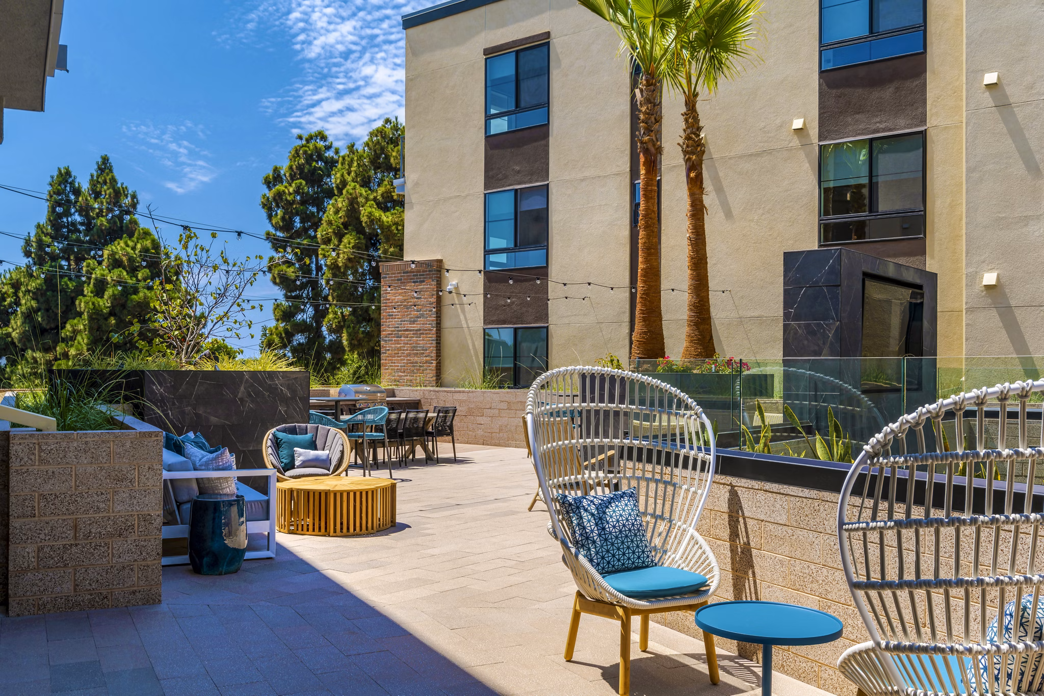 Chic patio with modern furniture at The Lofts at Carlsbad Village Apartments