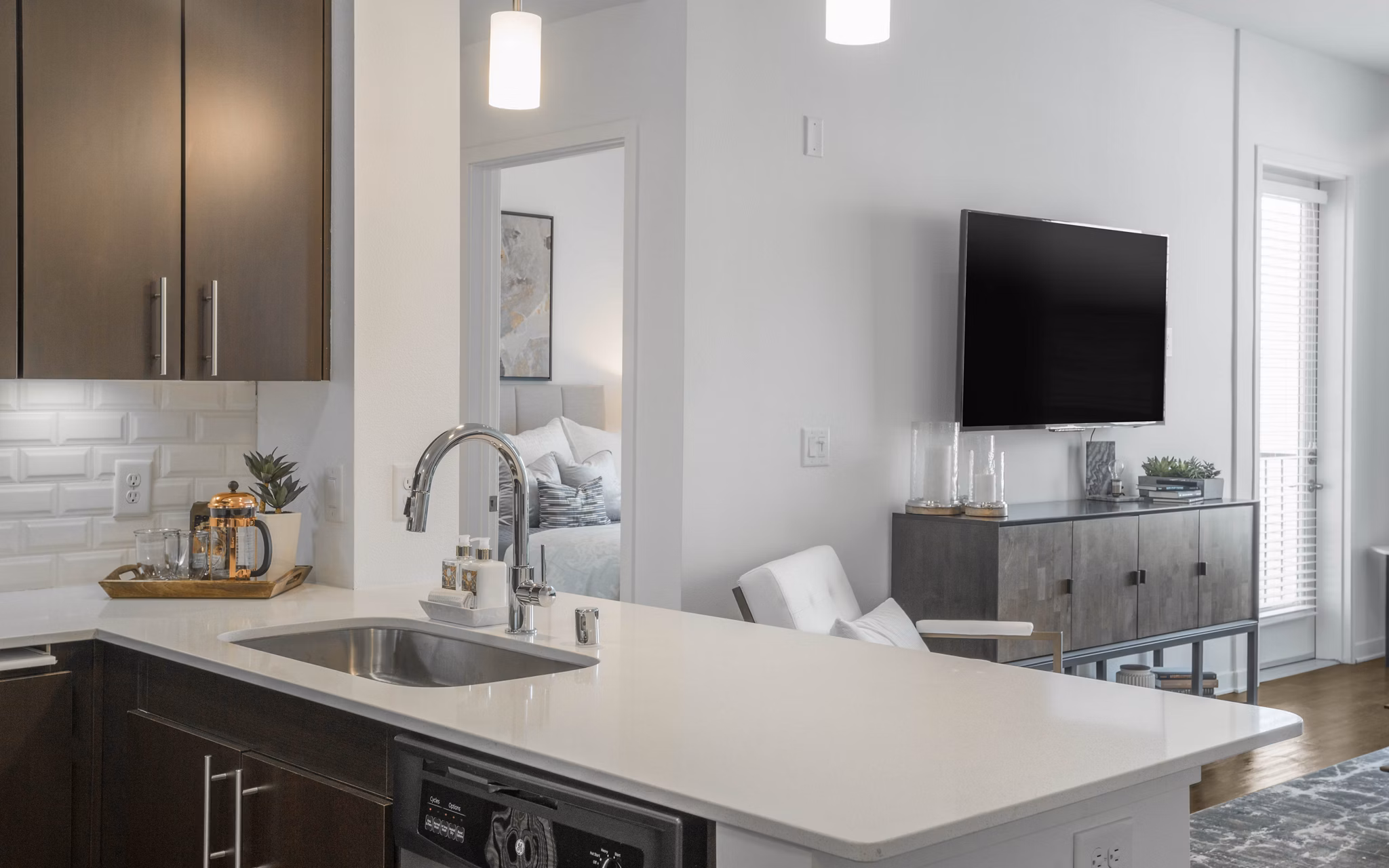 Modern kitchen with stainless steel appliances in Metro Mission Valley Apartments