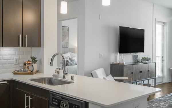 Modern kitchen with stainless steel appliances in Metro Mission Valley Apartments