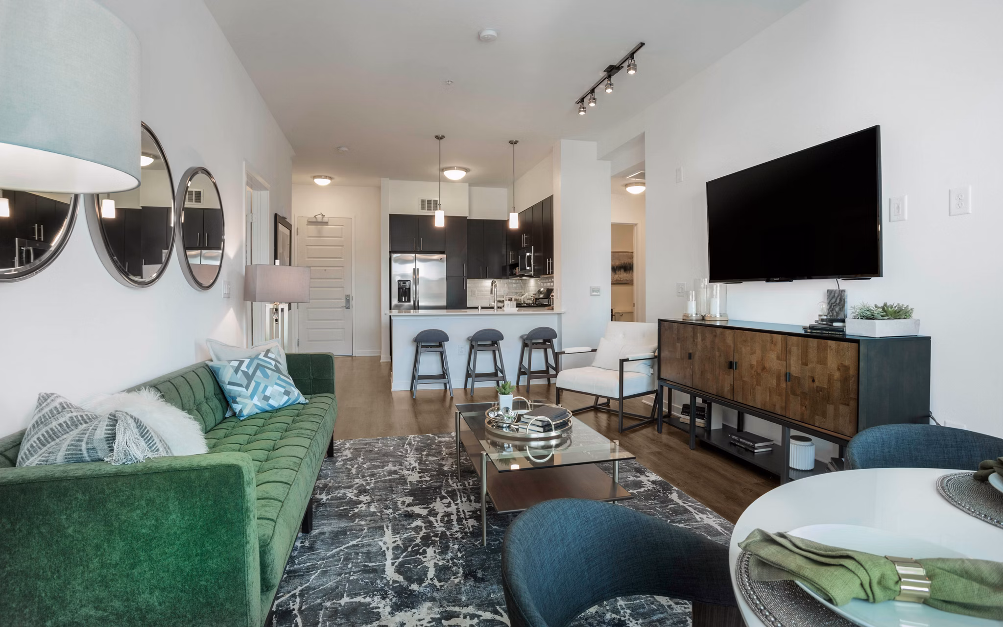 Modern living room with sleek furnishings and natural light at Metro Mission Valley Apartments