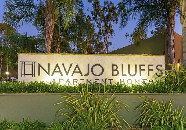 Navajo Bluffs Apartments: Modern signage at the entrance of a luxury property