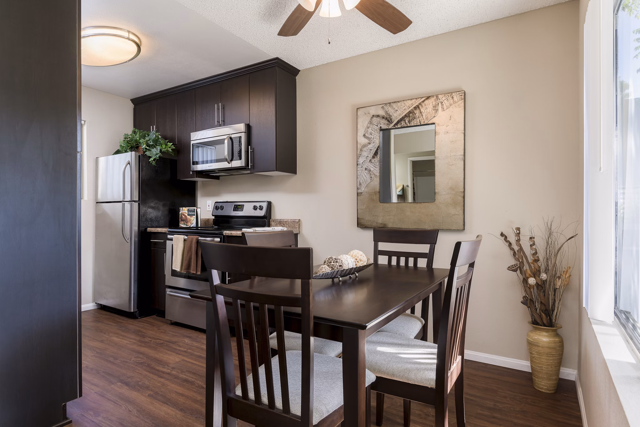 Dining area with modern decor at Navajo Bluffs Apartments featuring elegant lighting and seating