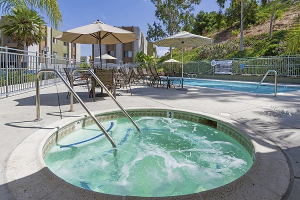 Relaxing hot tub at Navajo Bluffs Apartments with scenic views, offering a luxury amenity for residents seeking leisure and comfort