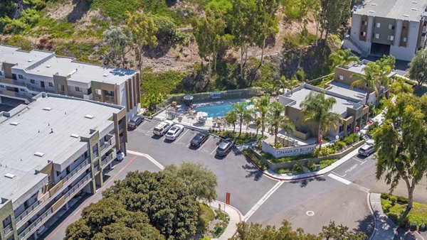 Navajo Bluffs Apartments: Scenic outdoor view featuring lush greenery and modern architecture