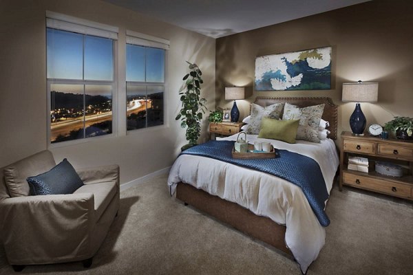 Cozy bedroom with ocean views at Ocean Air Apartments, featuring modern decor and ample natural light