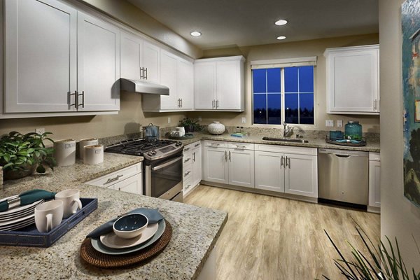 Modern kitchen with sleek cabinetry and stainless steel appliances in Ocean Air Apartments