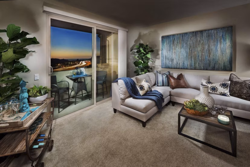 Spacious living room with contemporary decor at Ocean Air Apartments, featuring elegant furnishings and natural light