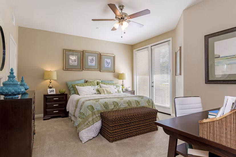 Cozy bedroom with modern decor at Riveredge Terrace Apartments