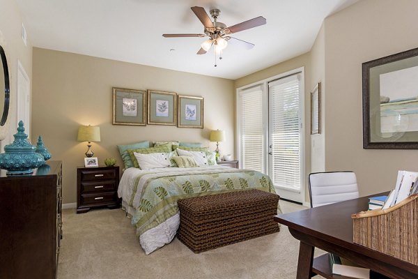 Cozy bedroom with modern decor at Riveredge Terrace Apartments