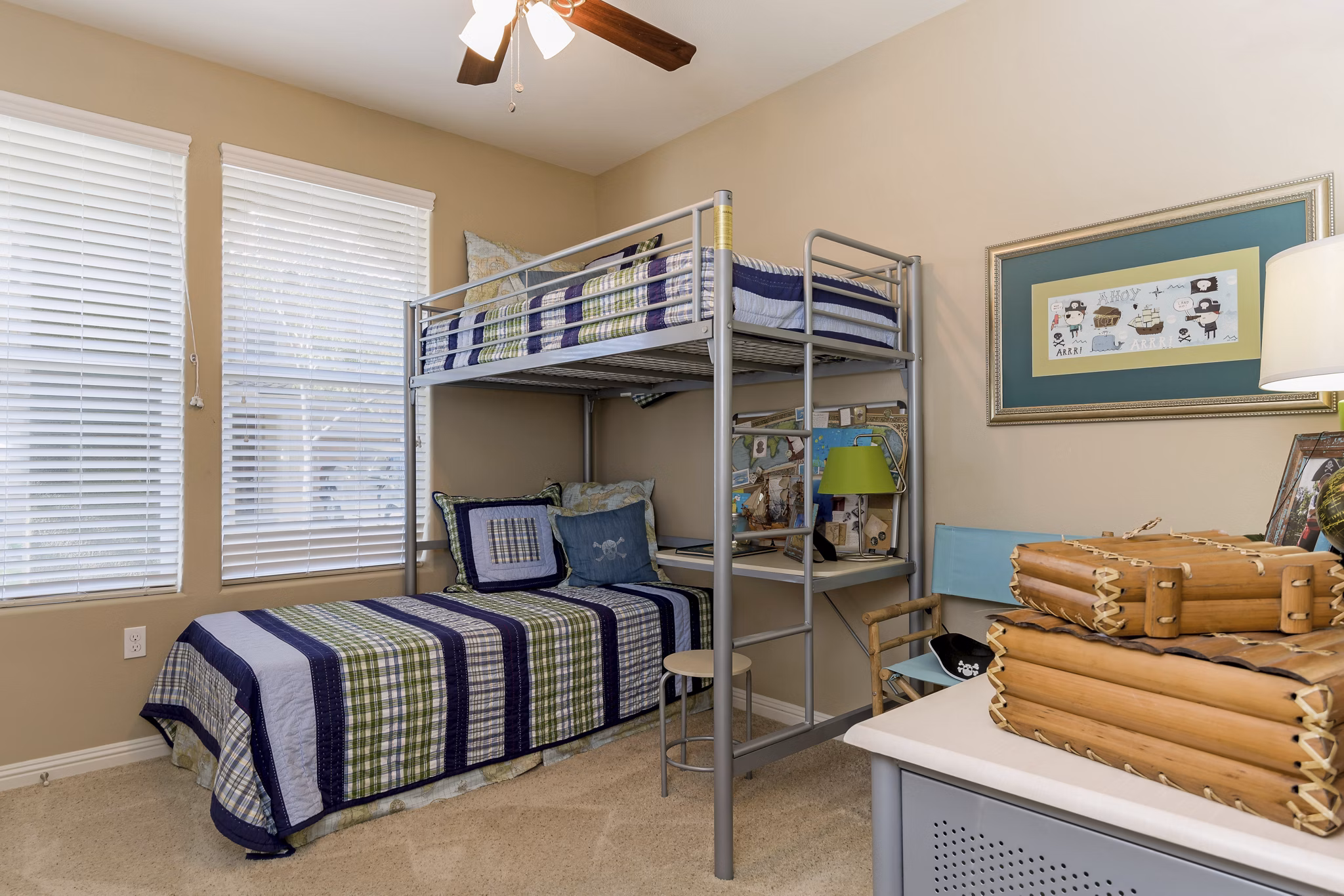 Cozy bedroom with stylish decor at Riveredge Terrace Apartments featuring luxury living by Greystar