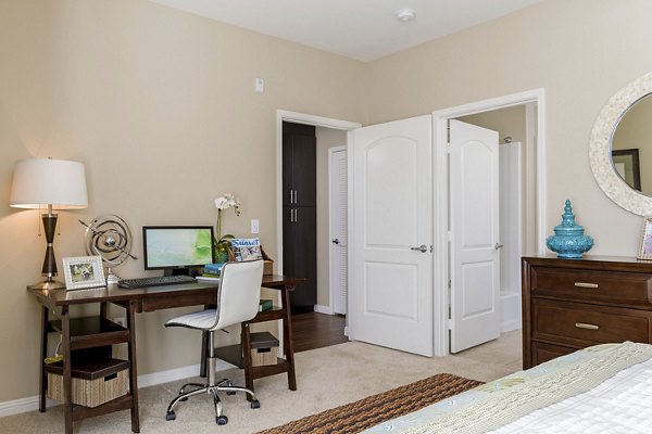 Bedroom with modern furnishings at Riveredge Terrace Apartments