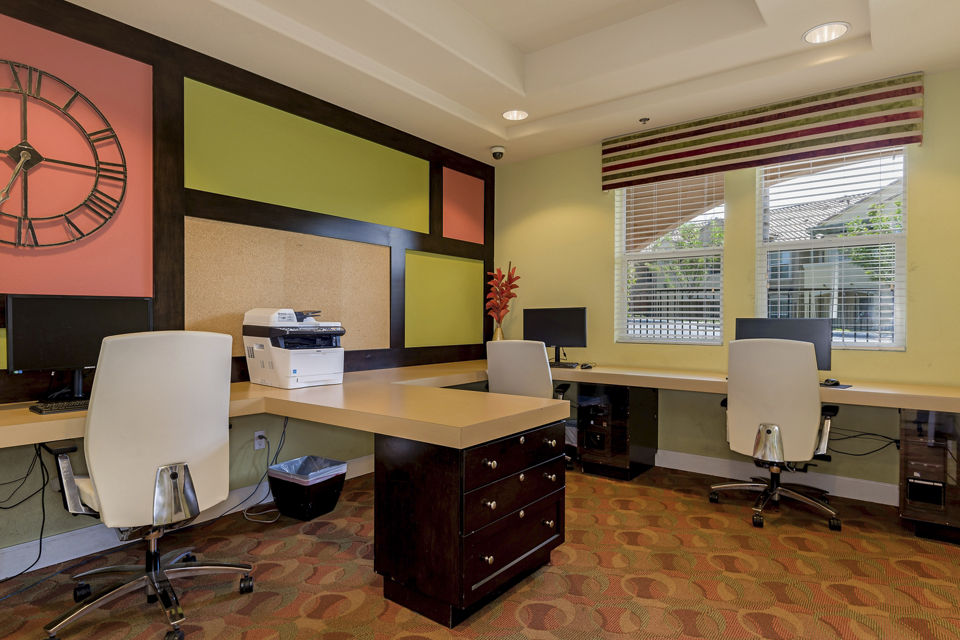 Modern business center with collaborative workspaces at Riveredge Terrace Apartments