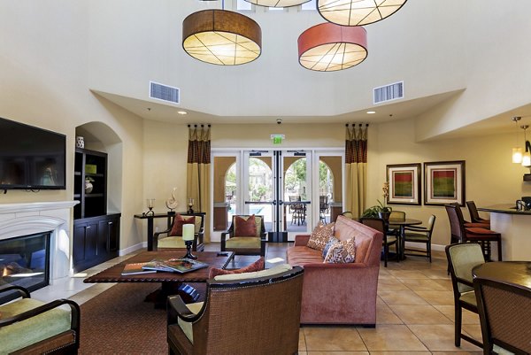 Clubhouse featuring modern design and comfortable seating at Riveredge Terrace Apartments, a luxury community by Greystar