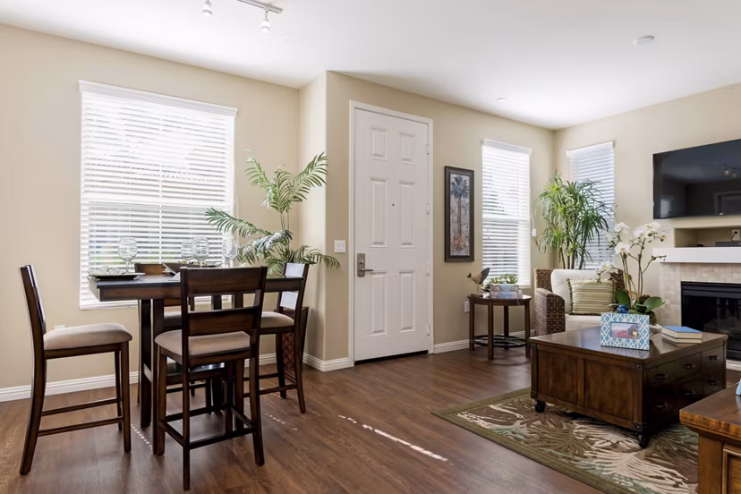 Dining area with modern furniture and lighting at Riveredge Terrace Apartments