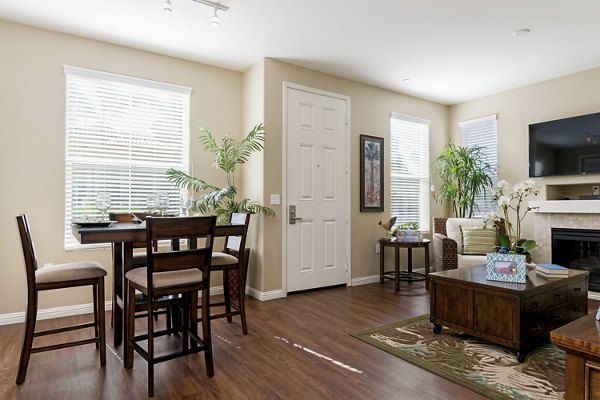 Dining area with modern furniture and lighting at Riveredge Terrace Apartments