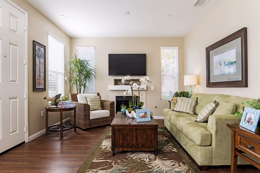 Open living room with modern decor and ample natural light at Riveredge Terrace Apartments, a luxury Greystar community
