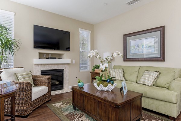 Spacious living room with modern decor at Riveredge Terrace Apartments