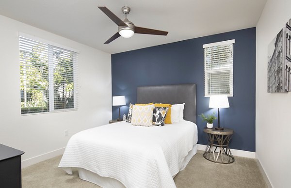 Cozy bedroom with modern furnishings at Palomar Station Apartments