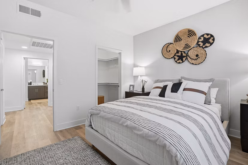 Bedroom featuring modern decor and ample natural light at Palomar Station Apartments