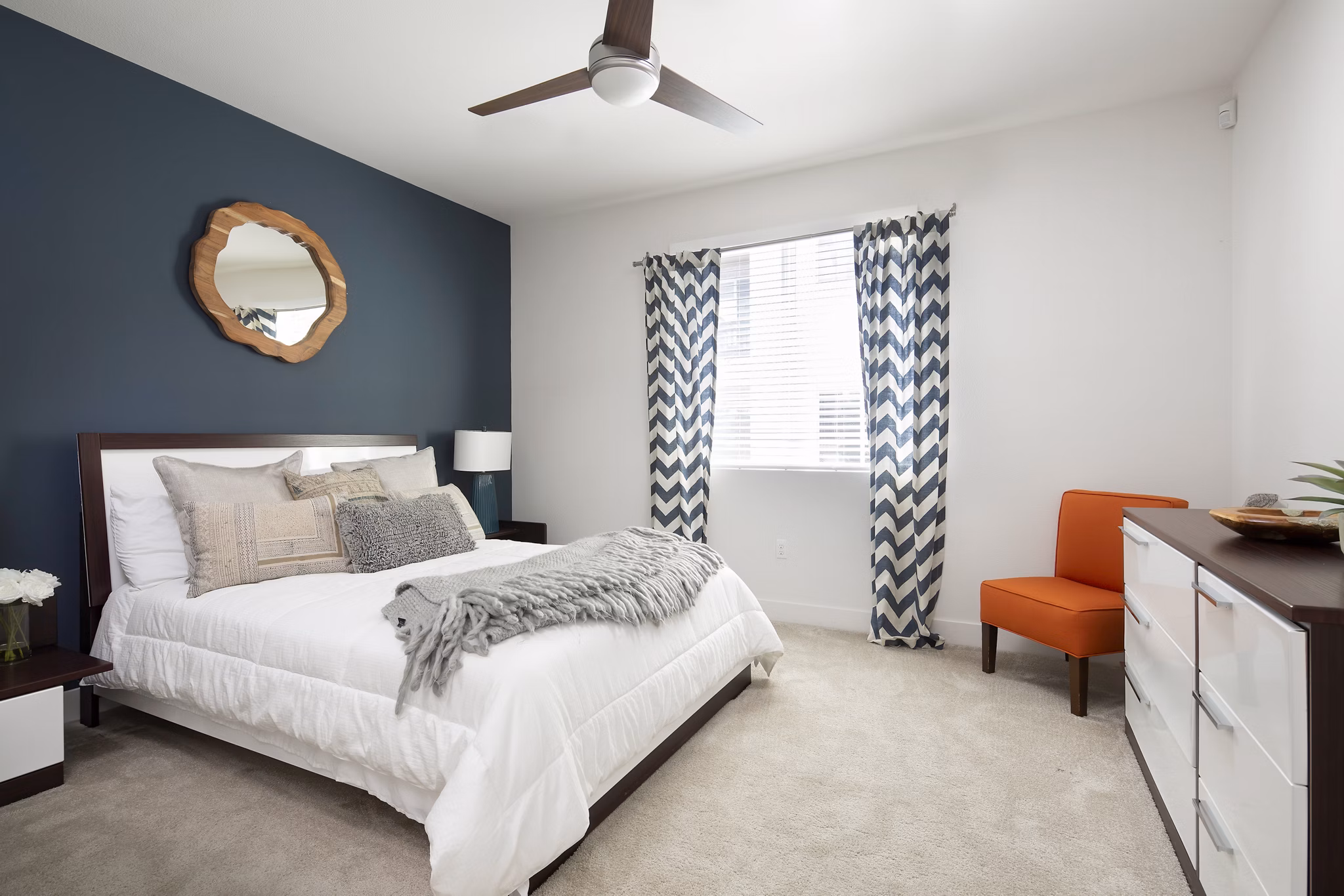 Bedroom featuring modern decor and ample natural light at Palomar Station Apartments
