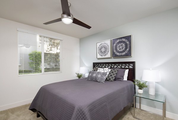 Elegant bedroom with modern furnishings at Palomar Station Apartments, showcasing luxury Greystar living spaces