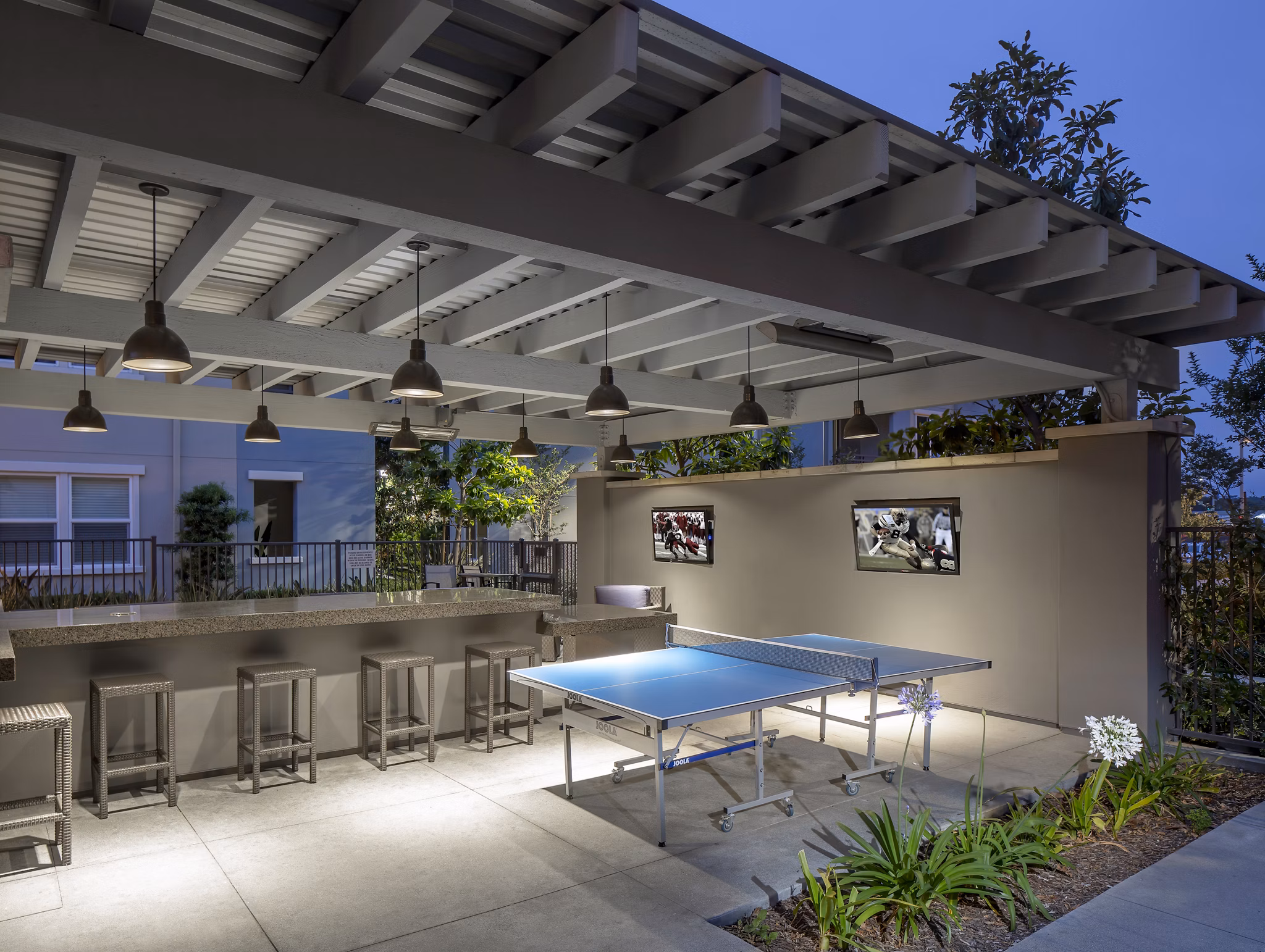 Inviting patio with modern seating at Palomar Station Apartments, ideal for luxury outdoor relaxation and gatherings