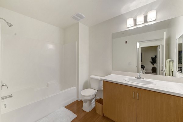 Bathroom with elegant marble countertops and modern fixtures at Parc One Apartments, promoting luxury living