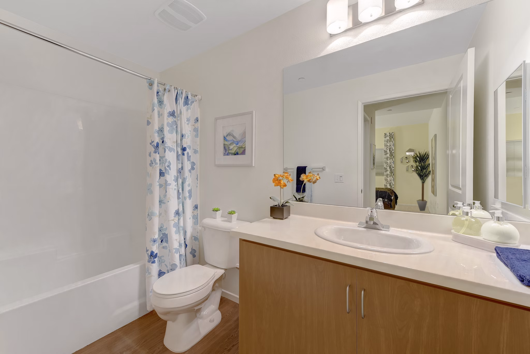 Modern bathroom with sleek fixtures and spacious vanity at Parc One Apartments