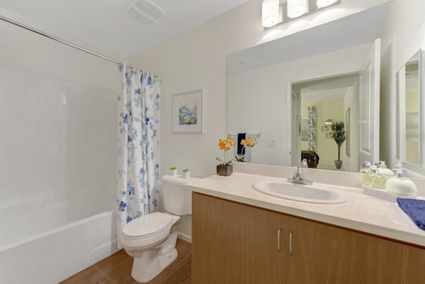 Modern bathroom with sleek fixtures and spacious vanity at Parc One Apartments