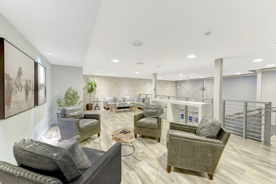 Modern clubhouse with sleek design at Parc One Apartments, offering luxury social spaces for residents