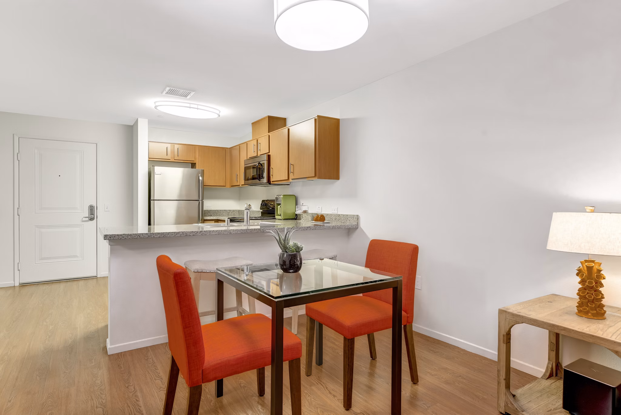 Elegant dining area featuring a stylish table setting in Parc One Apartments, offering luxury living experiences in an exclusive setting