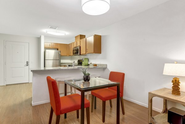 Elegant dining area featuring a stylish table setting in Parc One Apartments, offering luxury living experiences in an exclusive setting