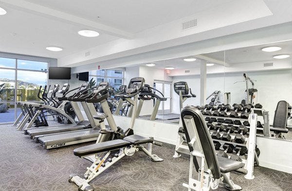 Parc One Apartments: Modern fitness center with state-of-the-art equipment in a luxurious setting