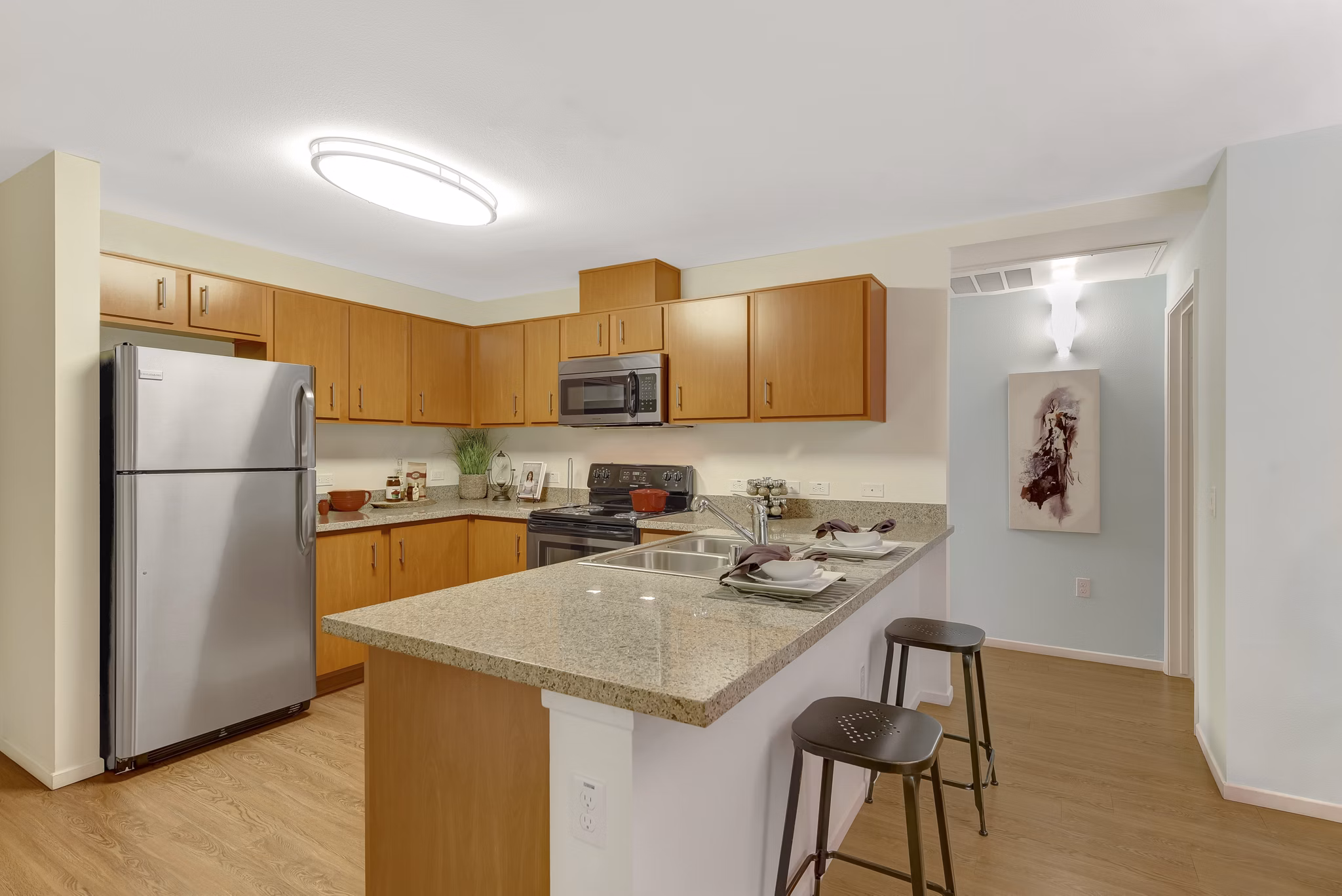 Sleek modern kitchen with stainless steel appliances at Parc One Apartments