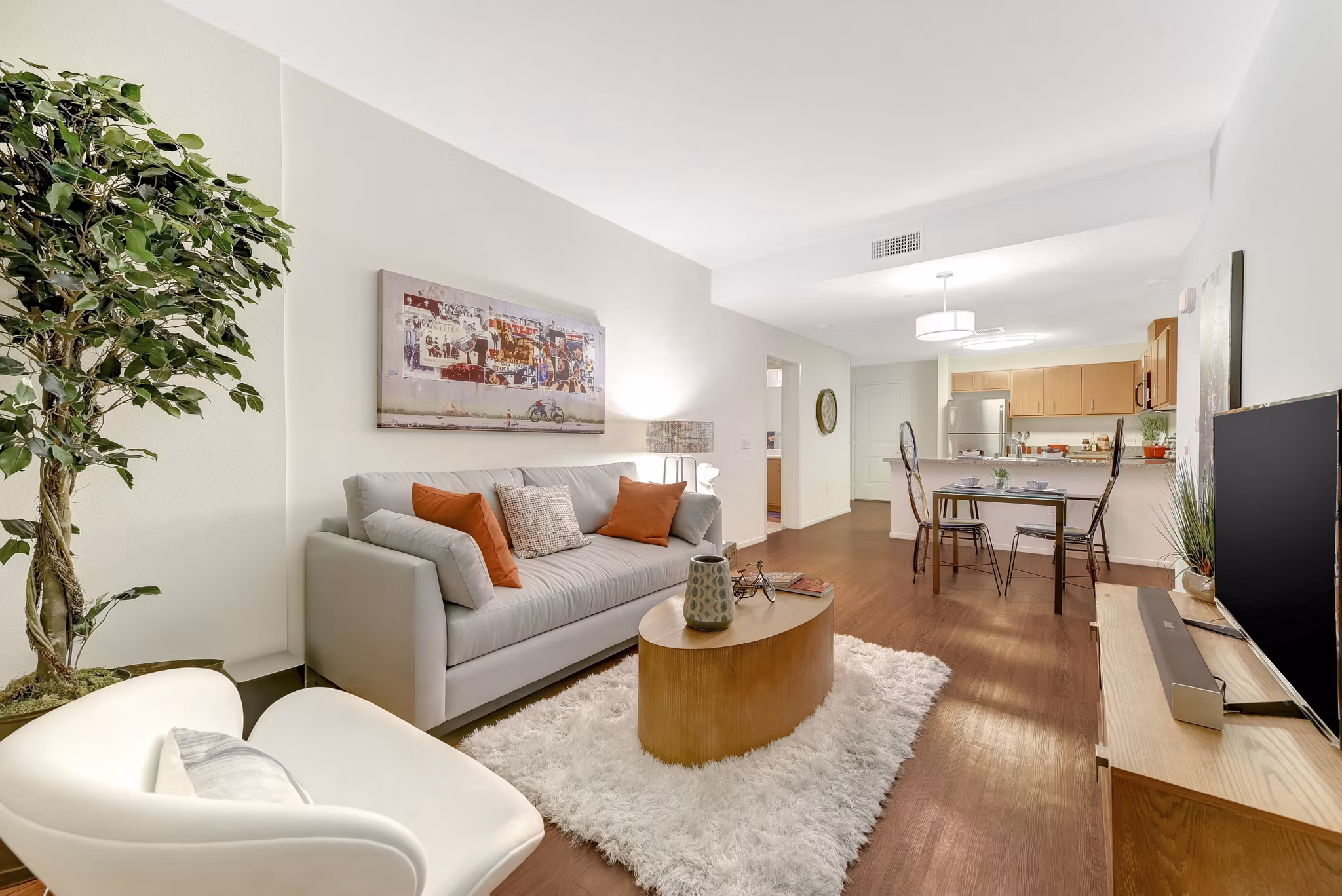 Modern living room featuring sleek furnishings and large windows at Parc One Apartments