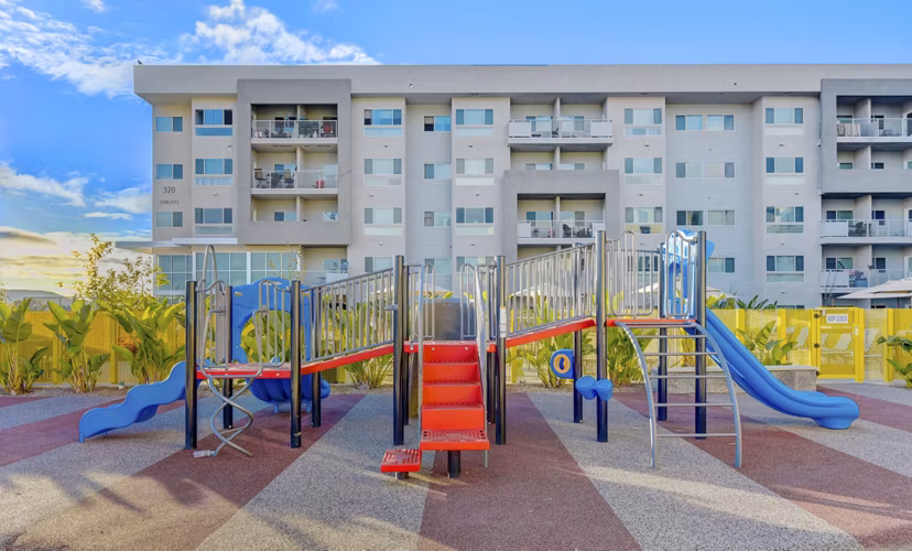 Colorful playground with modern equipment at Parc One Apartments, offering family-friendly outdoor activities for residents of all ages