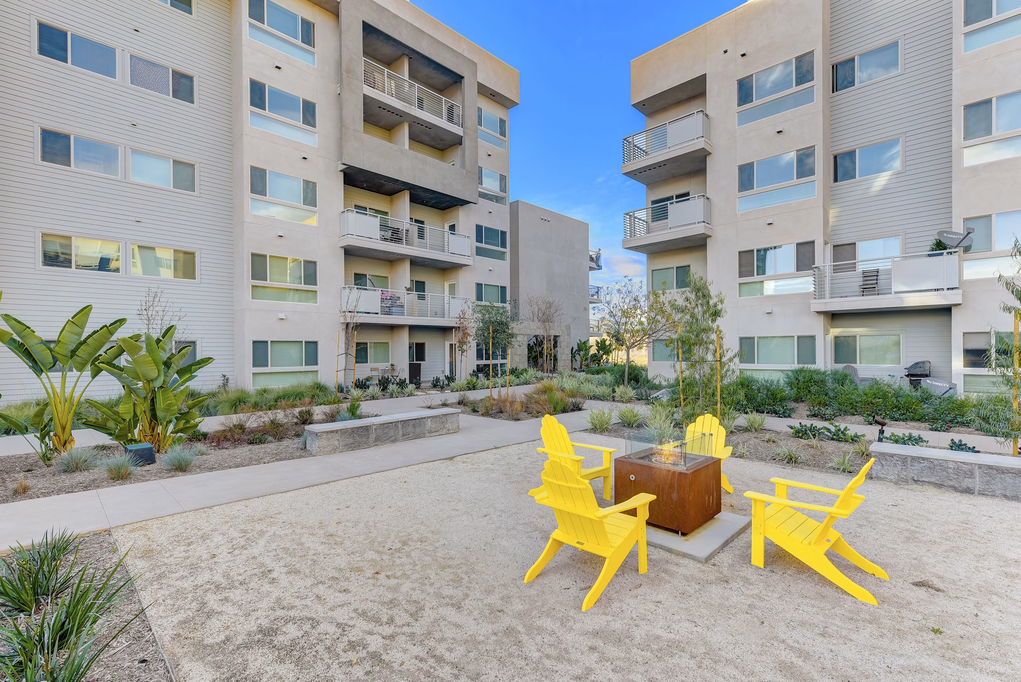 Fire pit lounge area at Parc One Apartments offering outdoor relaxation and ambiance
