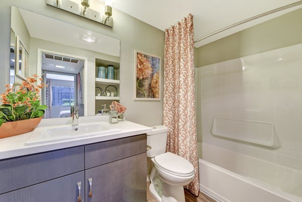 Modern bathroom with sleek fixtures and granite countertops in Park Pointe Apartments