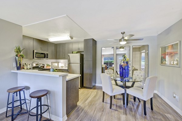 Dining area featuring modern furnishings and large windows in Park Pointe Apartments