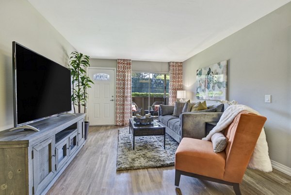 Elegant living room with modern furnishings and abundant natural light at Park Pointe Apartments