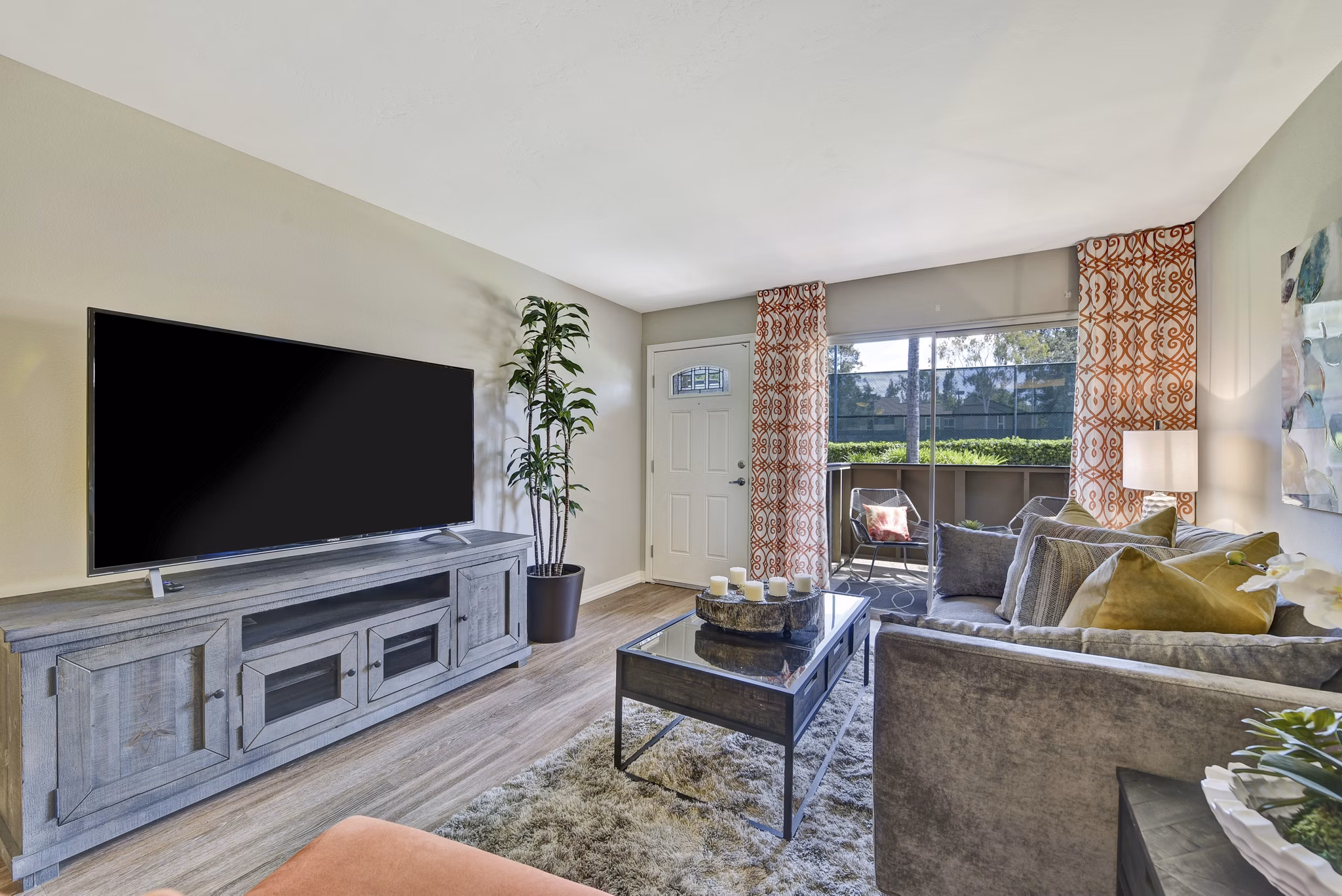 Spacious living room with modern decor and large windows in Park Pointe Apartments