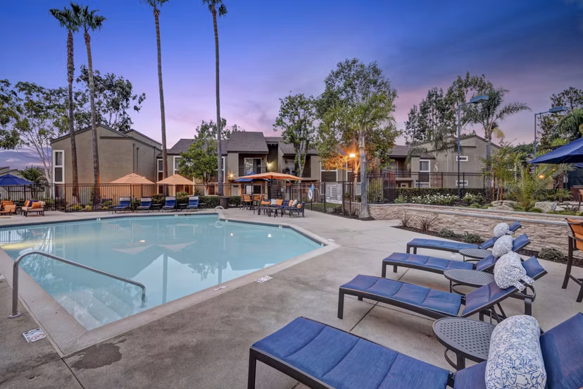 Relaxing pool area surrounded by lush landscaping at Park Pointe Apartments