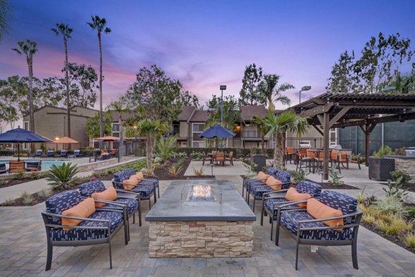 Cozy fire pit with seating area at Park Pointe Apartments, offering luxury outdoor lifestyle in Greystar community setting