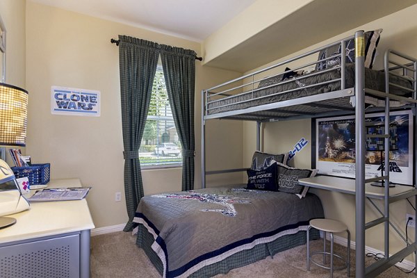 Cozy bedroom with stylish decor at Rosina Vista Apartments in luxury Greystar community