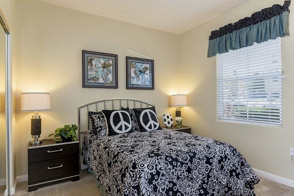 Cozy bedroom with natural light and modern decor at Rosina Vista Apartments, a luxury community by Greystar in Chula Vista