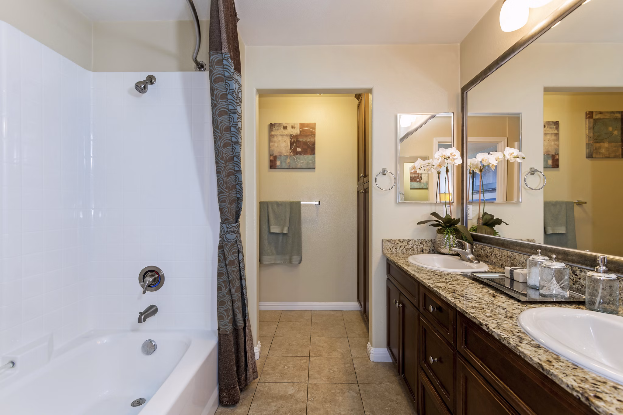 Modern bathroom featuring sleek fixtures and spacious vanity at Rosina Vista Apartments