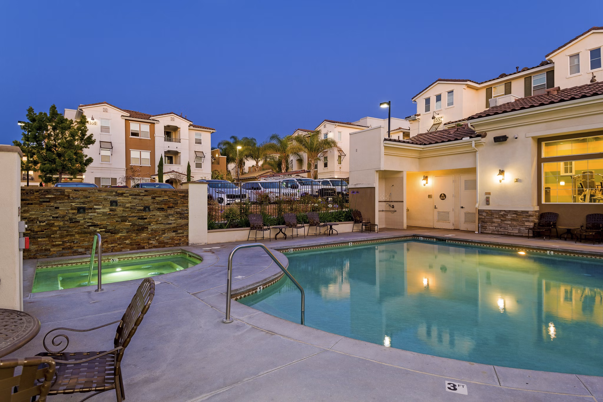 Resort-style pool with lounge chairs at Rosina Vista Apartments